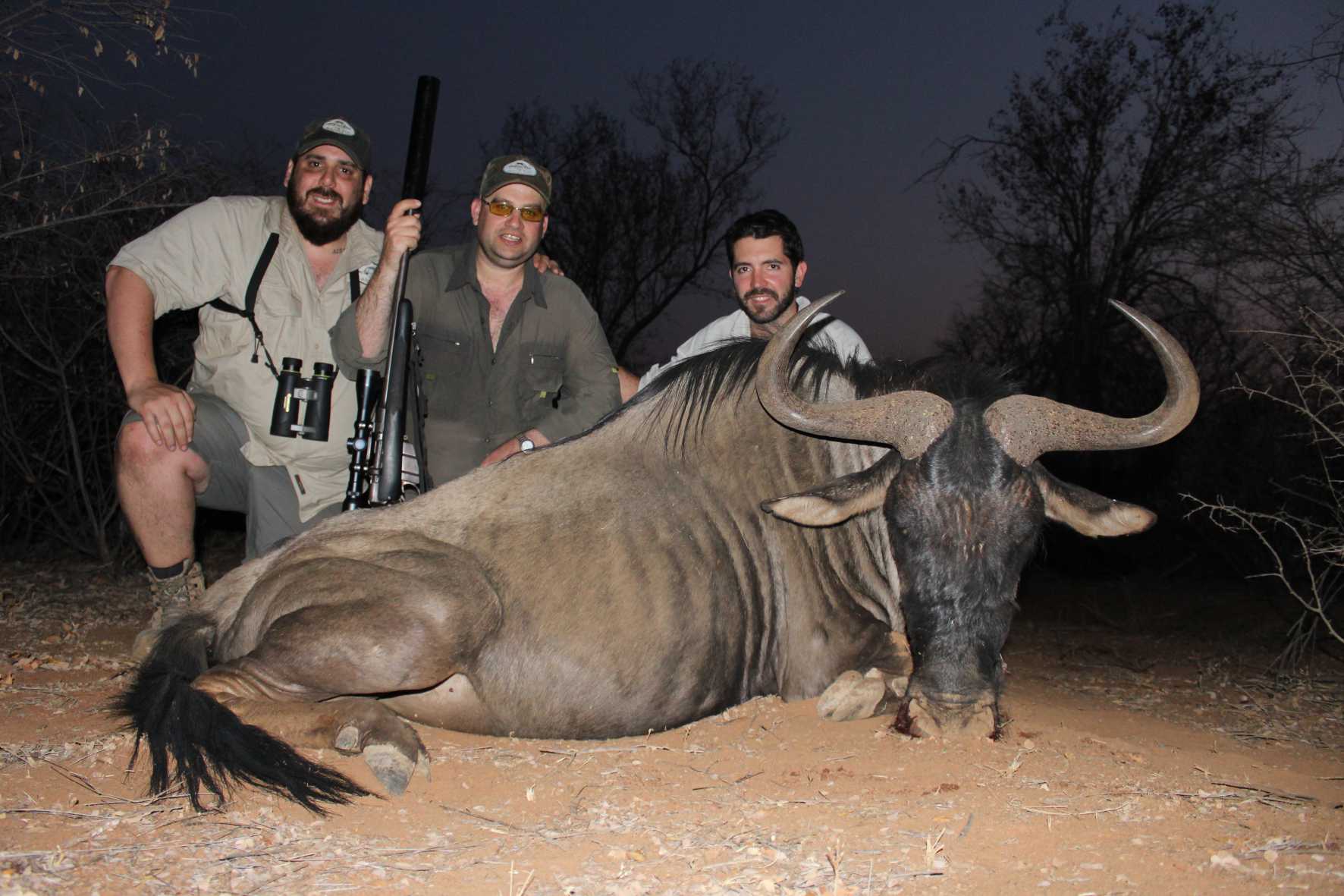 A client next to their hunting trophy