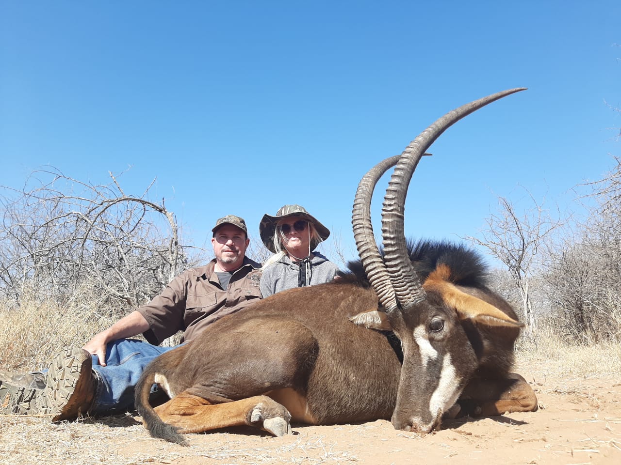 A client next to their hunting trophy