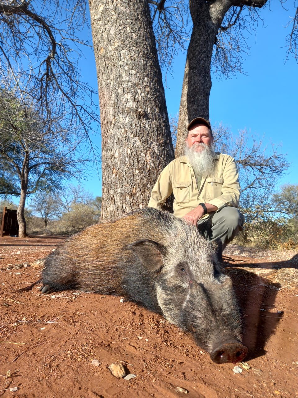 A client next to their hunting trophy