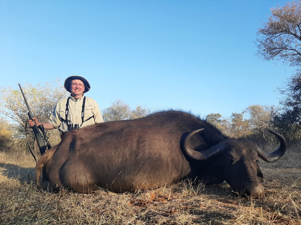 A client next to their hunting trophy