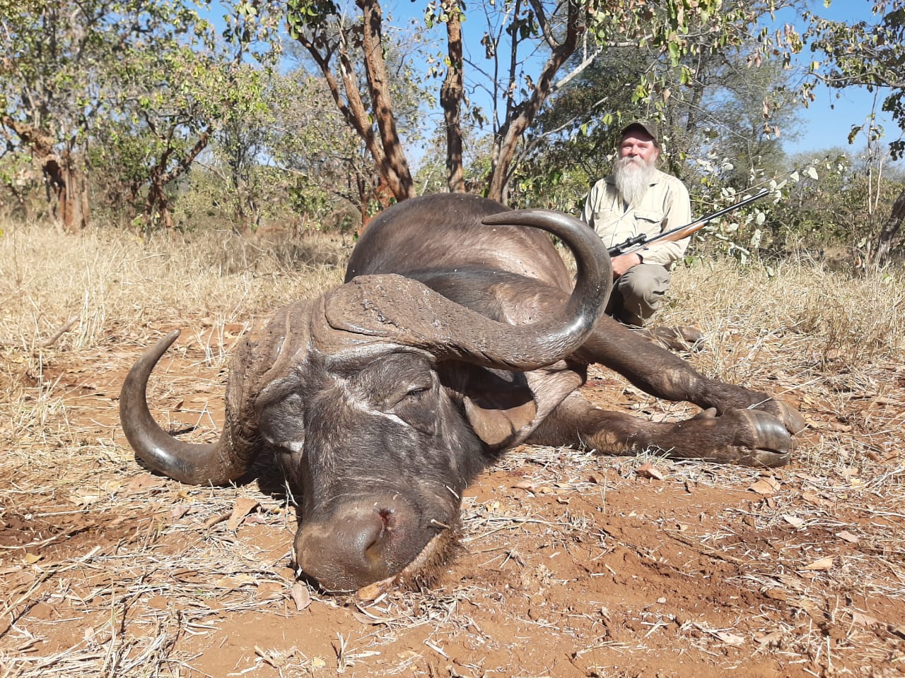 A client next to their hunting trophy