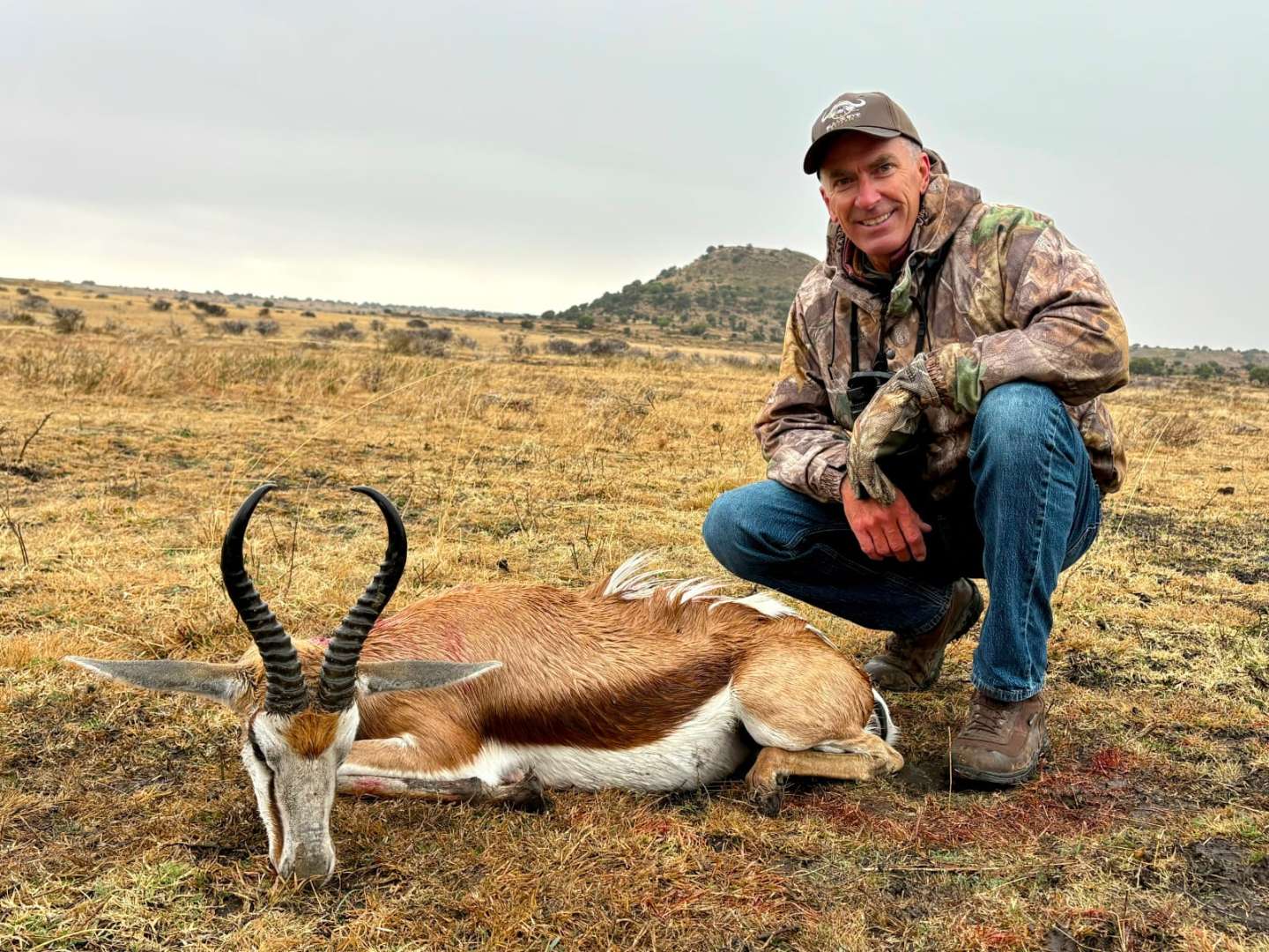 A client next to their hunting trophy