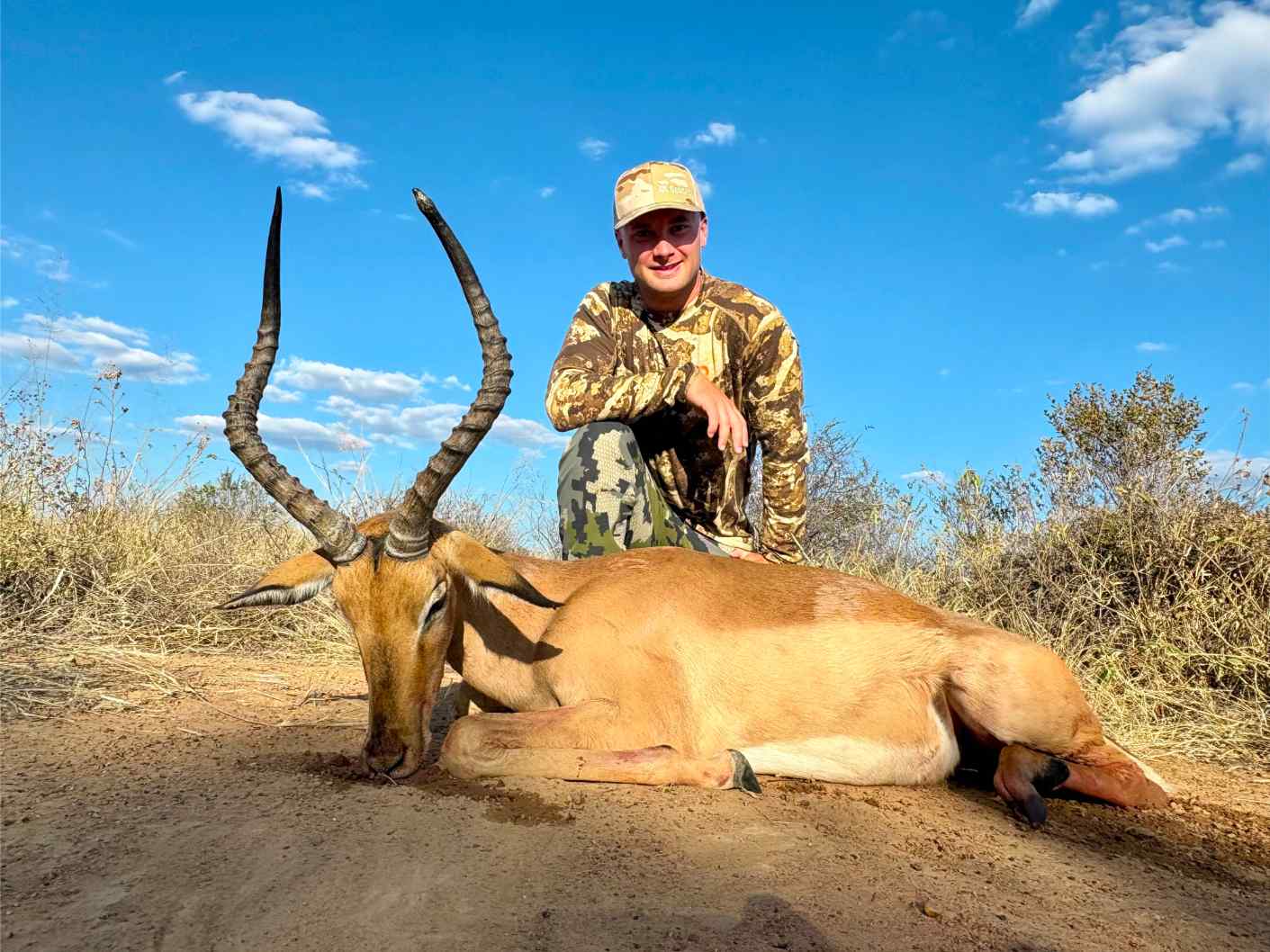 A client next to their hunting trophy
